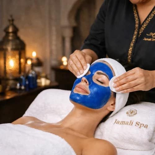 Gommage corps au Nila Bleu et Aker Fassi, masque visage et massage à l'huile d'argan à domicile à Marrakech — soin premium illuminant · Jamali Spa